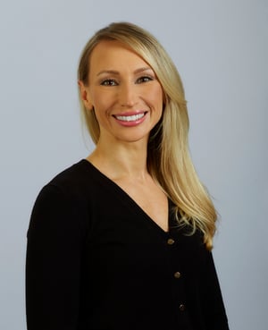 headshot of Dr. Natalya Lopushnyan, a woman with a black top and long blonde hair